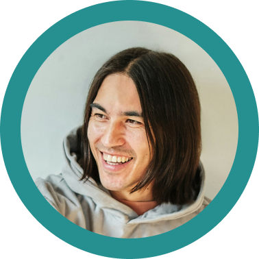 Headshot of a man with long hair in a teal circle